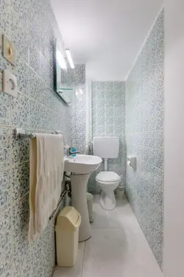 a bathroom with a sink and a toilet at Micasa Shiny Apartment in Rhodes Town