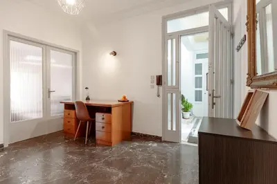 an office with a desk and a chair in a room at Micasa Shiny Apartment in Rhodes Town