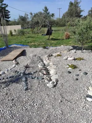 a group of rocks on a gravel yard at Mountain View Bungalows Dimilia in Phanaes
