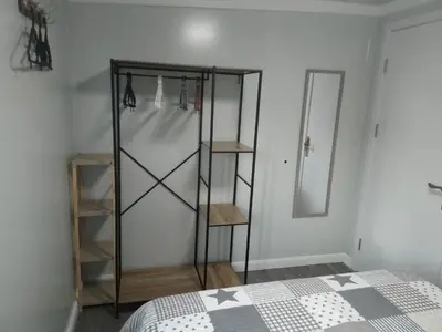 a bedroom with a bed and a glass closet at Mountain View Bungalows Dimilia in Phanaes