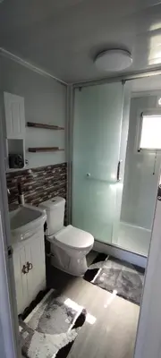 a bathroom with a toilet and a sink at Mountain View Bungalows Dimilia in Phanaes