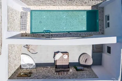 two views of a bathroom with a tub and a sink at Villa Gemma 2 next to Faliraki in Kalithies