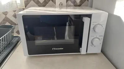 a microwave oven sitting on top of a counter at George & Chrysi Apart in Kremasti