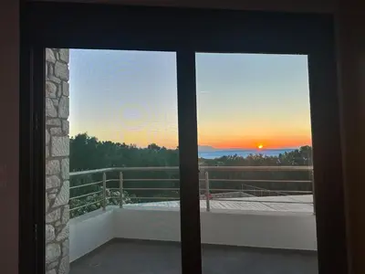 a view of a sunset from a window at Villa Solmar Rhodes in Lachania