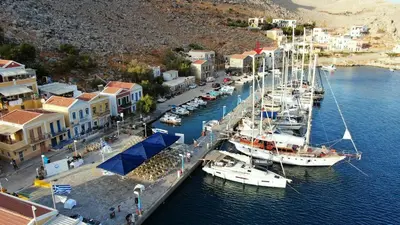 a group of boats are docked in a harbor at Perla di Mare - Katoi 1 in Symi