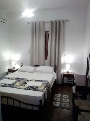 a bedroom with a large bed in a room at Perla di Mare - Katoi 1 in Symi