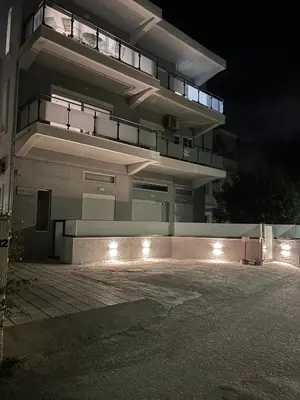 a building with lights in front of it at night at Kyra Maria 2, view Apartment in Rhodes Town