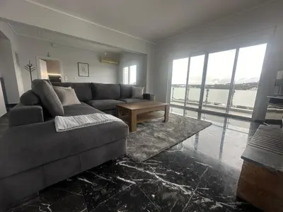 a living room with a couch and a table at Kyra Maria 2, view Apartment in Rhodes Town