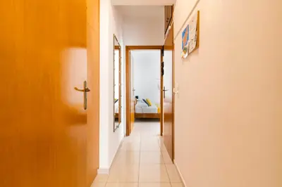 a hallway leading to a bedroom in a house at Sunset View in Rhodes Town