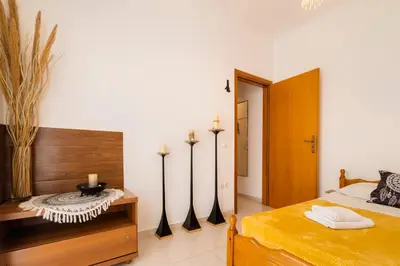 a bedroom with a bed with four surfboards on the wall at Sunset View in Rhodes Town