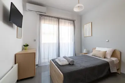 a bedroom with a bed with two towels on it at Niovis Villa in Pastida