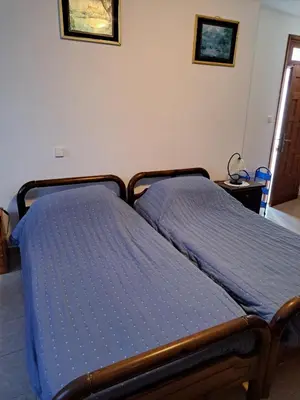 a bed in a bedroom with a blue mattress at Terrace Studio in Rhodes Town
