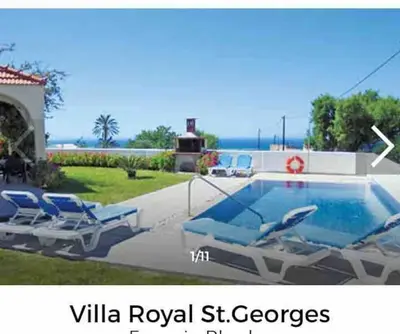 a swimming pool with lounge chairs next to a house at Welcome to relaxation in Phanaes