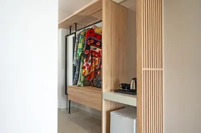 a walk in pantry with wooden dividers in a room at Ampelia Hotel in Gennadi