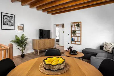 a living room with a table with a bowl of lemons at D'Amboise House in Rhodes Town