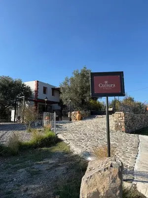 a sign that says calitta on a stone road at Cullura in Asklipiḯon