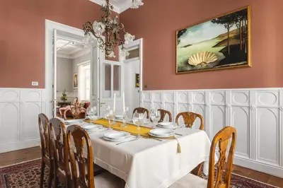 a dining room with a white table and chairs at Victoria Mansion A Luxurious Neoclassical Experience in Rhodes Town