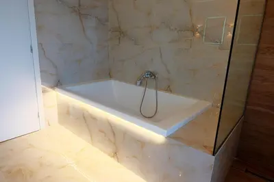 a bathroom with a bath tub with a shower at Hillside Horizon Villa in Rhodes Town