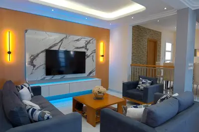 a living room with two couches and a flat screen tv at Hillside Horizon Villa in Rhodes Town