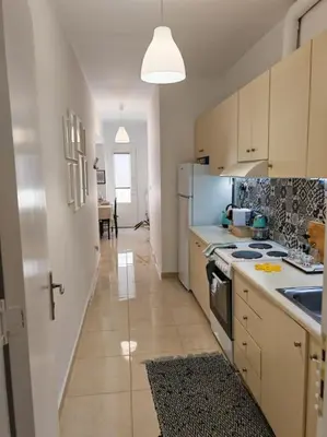 a kitchen with a sink and a stove top oven at Leo's & Xerxes' place in the Heart of Rhodes in Rhodes Town