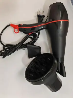 a hair dryer with a wire attached to it at Leo's & Xerxes' place in the Heart of Rhodes in Rhodes Town