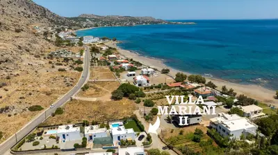 an aerial view of a beach with a sign that reads willa marant at Villa Mariani II - in Lothiarika, newly renovated June 2024, private pool, Lindos 10 min, beach 120m in Lardos