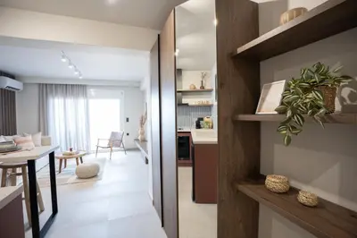 a kitchen and living room with a table and a dining room at Sunny Sands Seaview Apartment in Archangelos