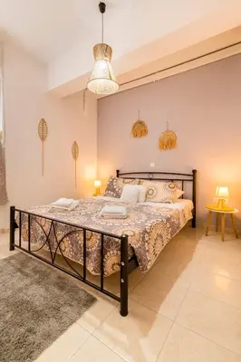 a bedroom with a large bed in a room at Lilliput Garden in Rhodes Town