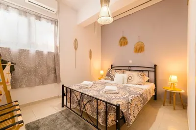 a bedroom with a bed and a window at Lilliput Garden in Rhodes Town