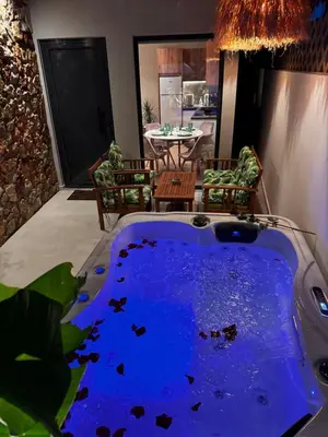 a jacuzzi tub in the middle of a living room at City Compass Luxury Suites Faliraki in Faliraki