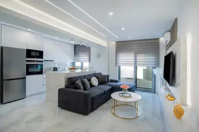 a living room with a couch and a table at Rhodes Center Luxury Suite in Rhodes Town