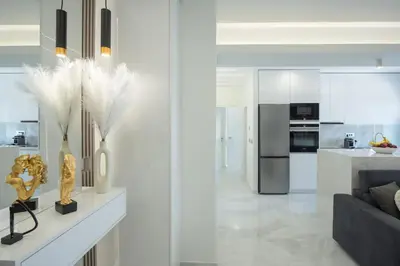 a living room with a couch and a kitchen at Rhodes Center Luxury Suite in Rhodes Town