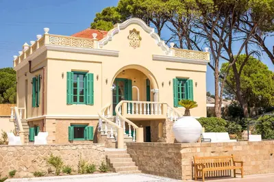 a house with a staircase in front of it at Villa Luna Piena in Pefki Rhodes