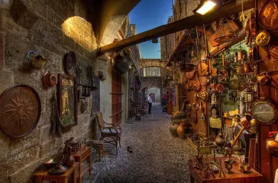 an alley in a building with a lot of items on the walls at Elia Suites - Old Town in Rhodes Town