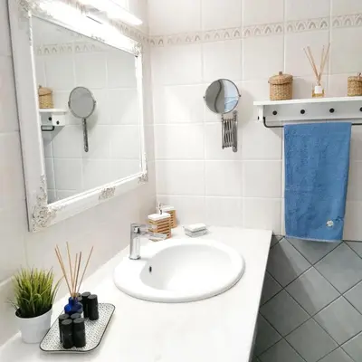 a bathroom with a sink and a mirror at Alexandra's Sea Front Villa in Pefki Rhodes