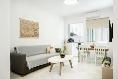 a living room with a couch and a table at Gio Center Apartment in Rhodes Town