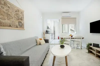 a living room with a couch and a table at Gio Center Apartment in Rhodes Town