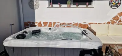 a bath tub with water coming out of it at Stergios Suite with Private Jacuzzi in Kolimbia