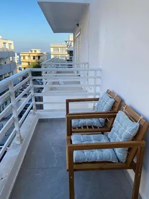 a bench on the balcony of a building at New Best Priced Walkable Beach Sites City Rhodes Town Apartment in Rhodes Town