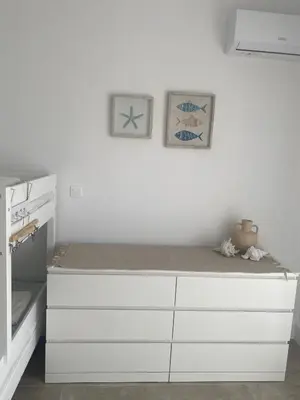 a white room with a bed with white cabinets at New Best Priced Walkable Beach Sites City Rhodes Town Apartment in Rhodes Town