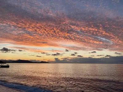 a sunset over a body of water at New Best Priced Walkable Beach Sites City Rhodes Town Apartment in Rhodes Town