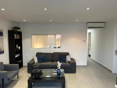 a living room with a couch and a coffee table at Melita Downtown Seaview in Rhodes Town