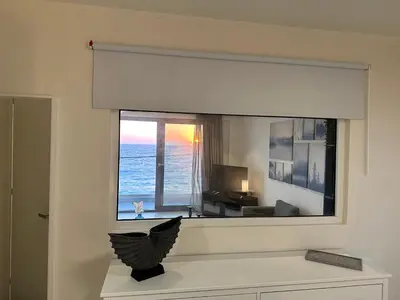 a room with a large window with a view of the ocean at Melita Downtown Seaview in Rhodes Town