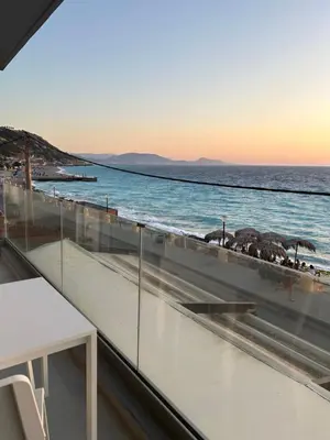 a view of the ocean from the balcony of a building at Melita Downtown Seaview in Rhodes Town