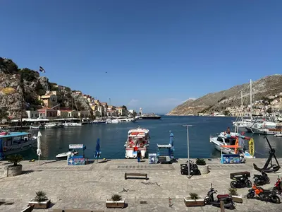a group of boats docked in a harbor at Amorosa House in Symi