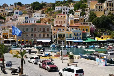 a group of cars parked next to a marina at Amorosa House in Symi