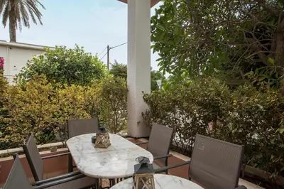 a patio with a table and chairs on a balcony at Thelia Rhodian Traditional house in Rhodes Town