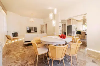 a kitchen and dining room with a table and chairs at Costa-Aria House in Ixia