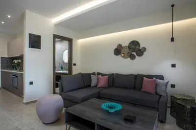 a living room with a couch and a table at Matsi Suites in Faliraki