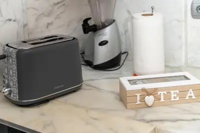 a toaster sitting on a counter next to a paper towel at Casa della Pace in Ialyssos